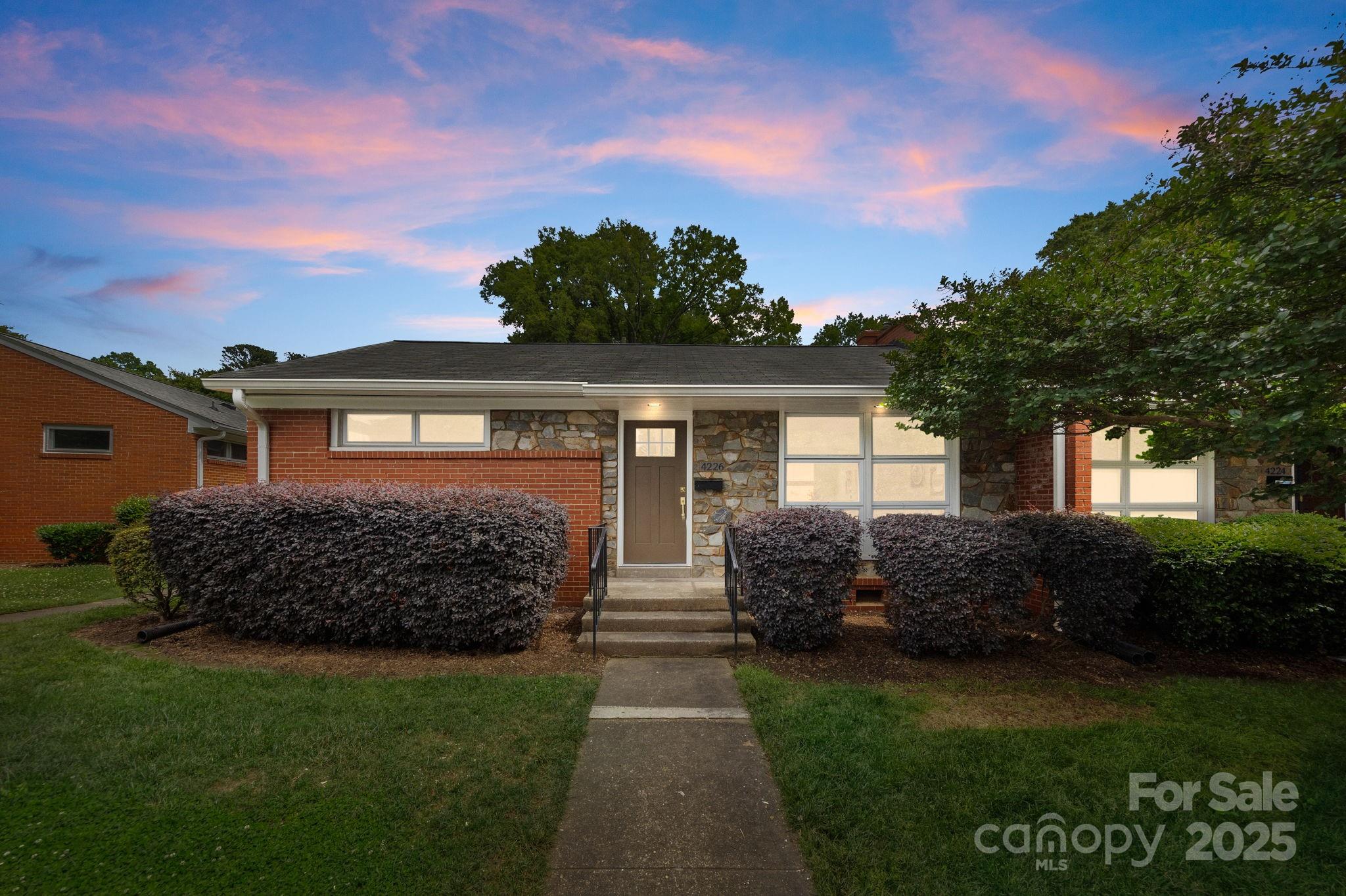 4226 Randolph Road Charlotte, NC 28211 - Photo 1 of 23 a front view of a house with garden
