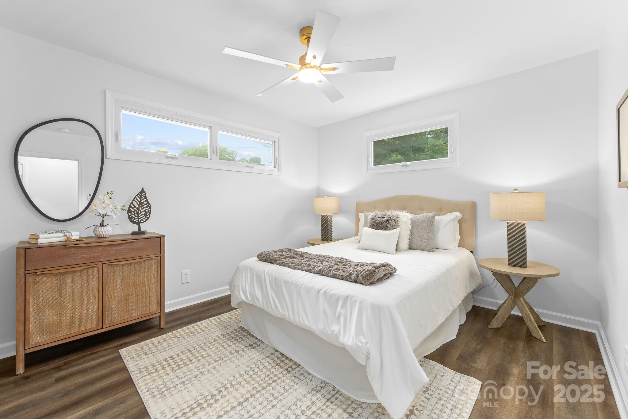4226 Randolph Road Charlotte, NC 28211 - Photo 14 of 23 a bedroom with a bed and a mirror