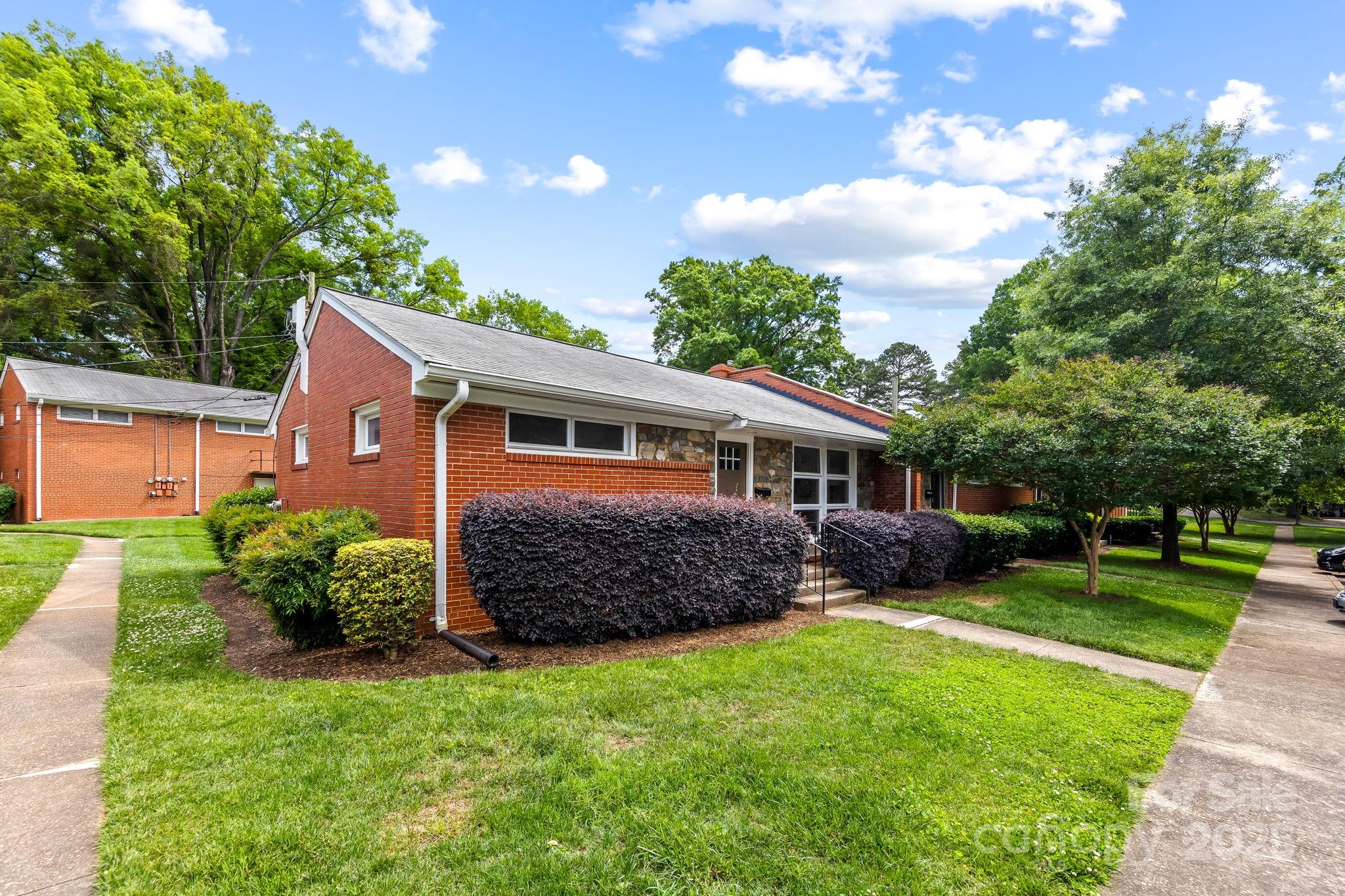 4226 Randolph Road Charlotte, NC 28211 - Photo 23 of 23 a front view of a house with garden