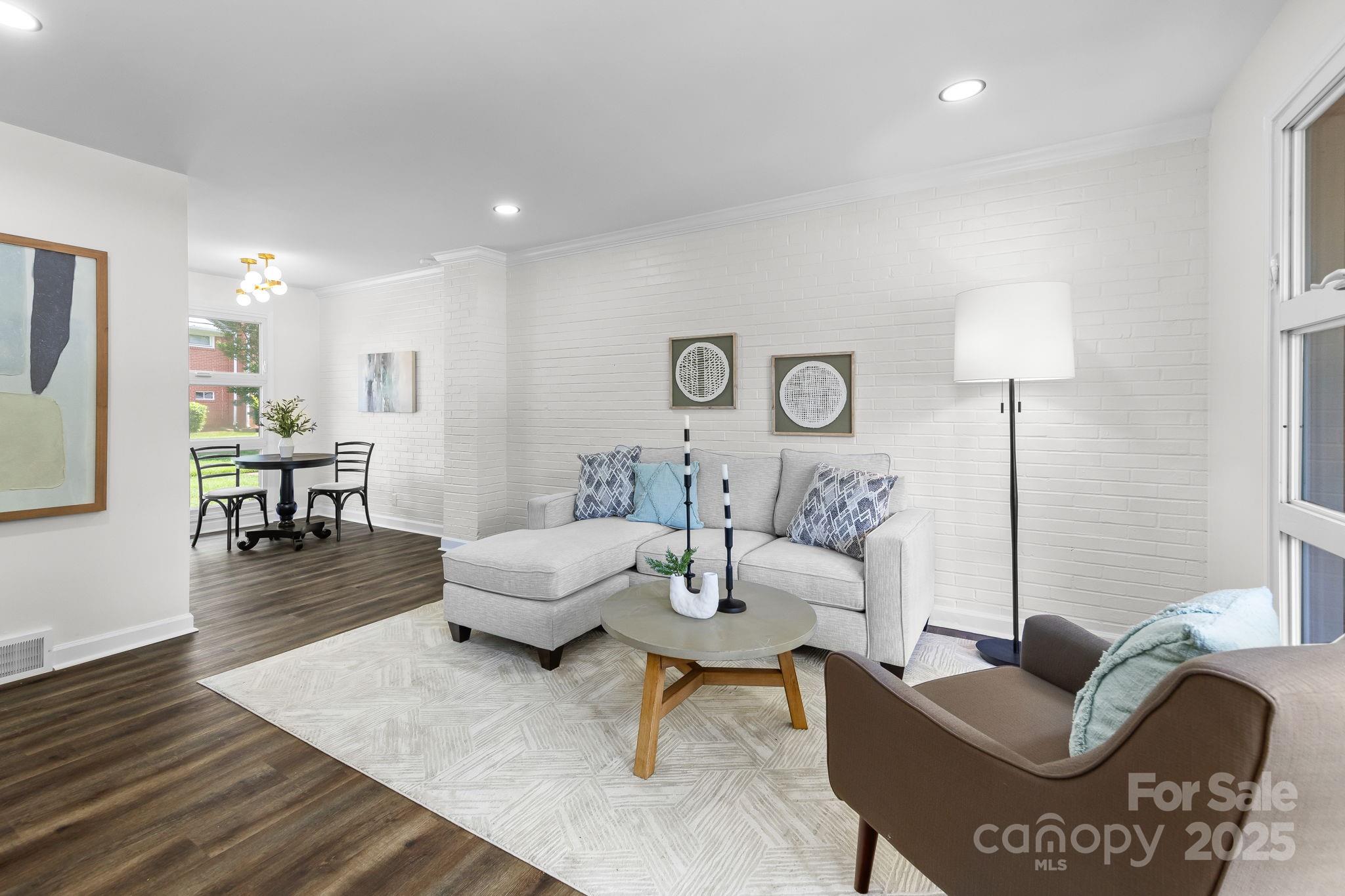 4226 Randolph Road Charlotte, NC 28211 - Photo 3 of 23 a living room with furniture and wooden floor