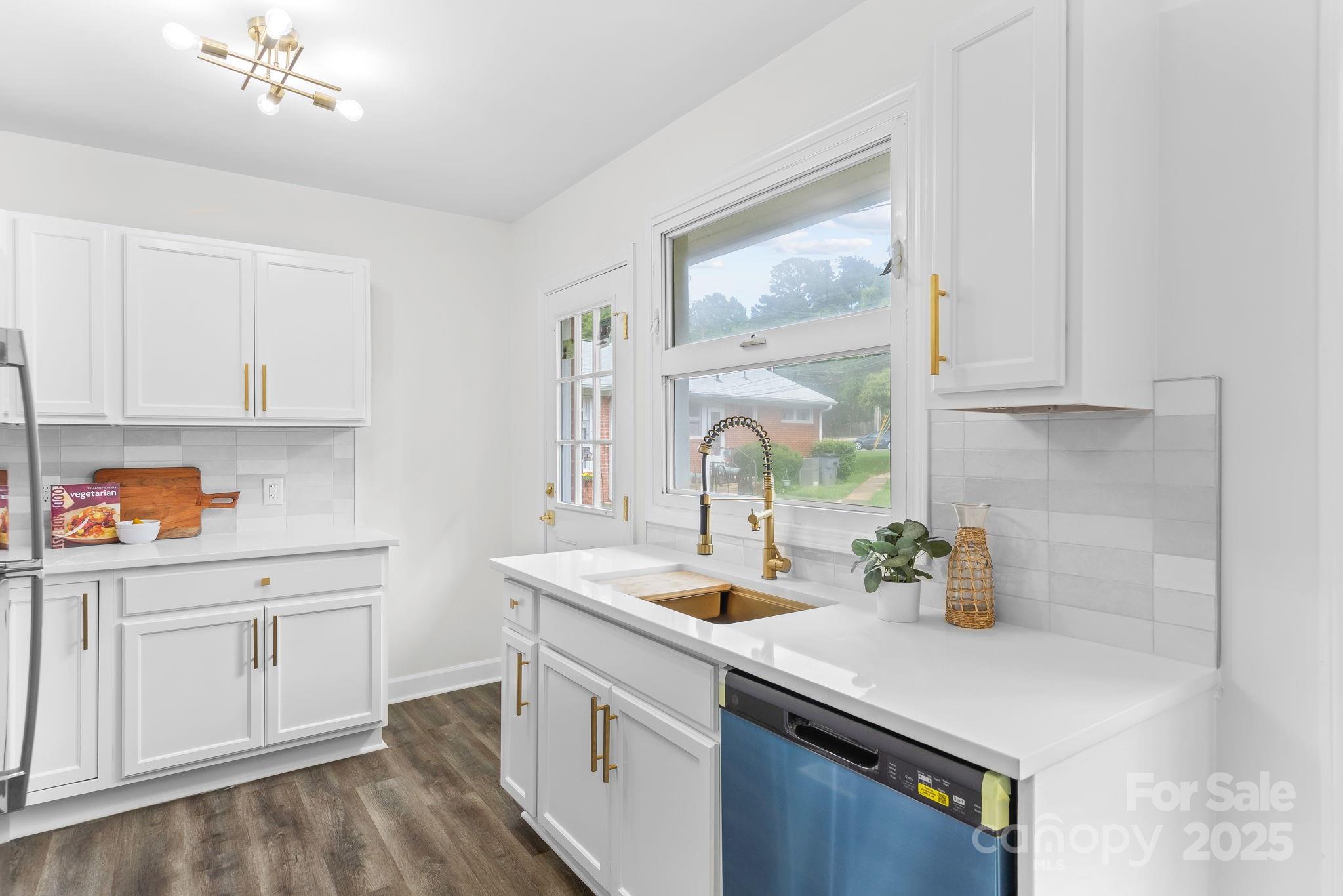 4226 Randolph Road Charlotte, NC 28211 - Photo 10 of 23 a kitchen with a sink cabinets and appliances