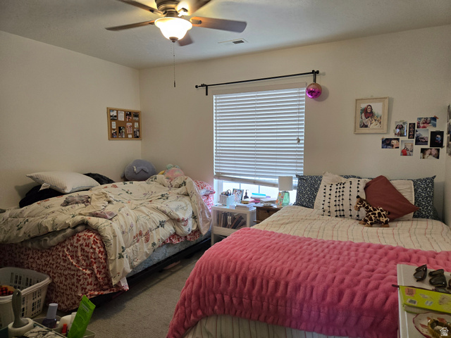 343 300 North, Unit 9 Provo, UT 84601 - Photo 8 of 10 Bedroom featuring ceiling fan and carpet