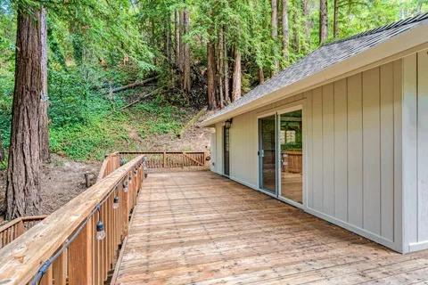 a view of balcony with wooden floor