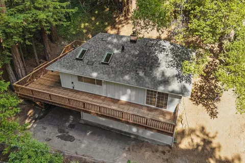 a kitchen with granite countertop a stove top oven microwave and cabinets