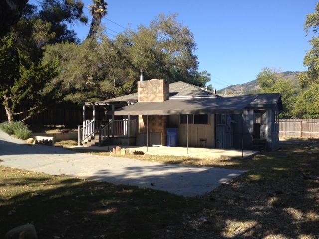 10132 Creek Road Oak View, CA 93022 - Photo 1 of 11 a front view of a house with a yard
