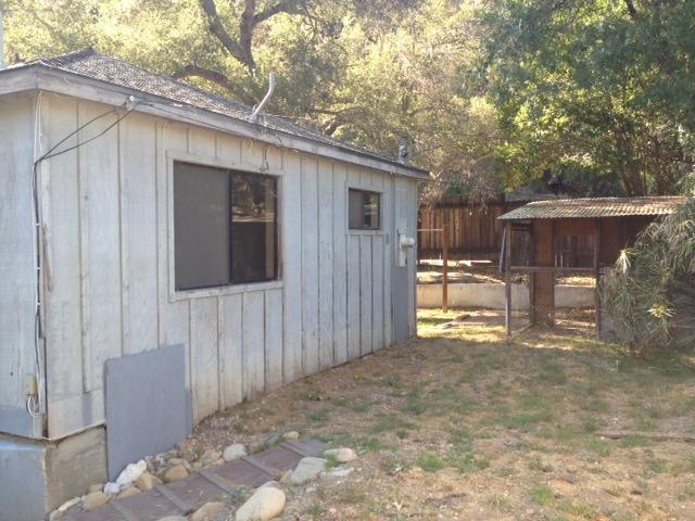 10132 Creek Road Oak View, CA 93022 - Photo 6 of 11 a backyard of a house with table and chairs