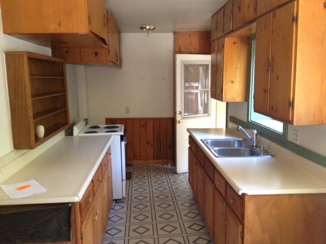 10132 Creek Road Oak View, CA 93022 - Photo 7 of 11 a kitchen with a sink a stove and a refrigerator
