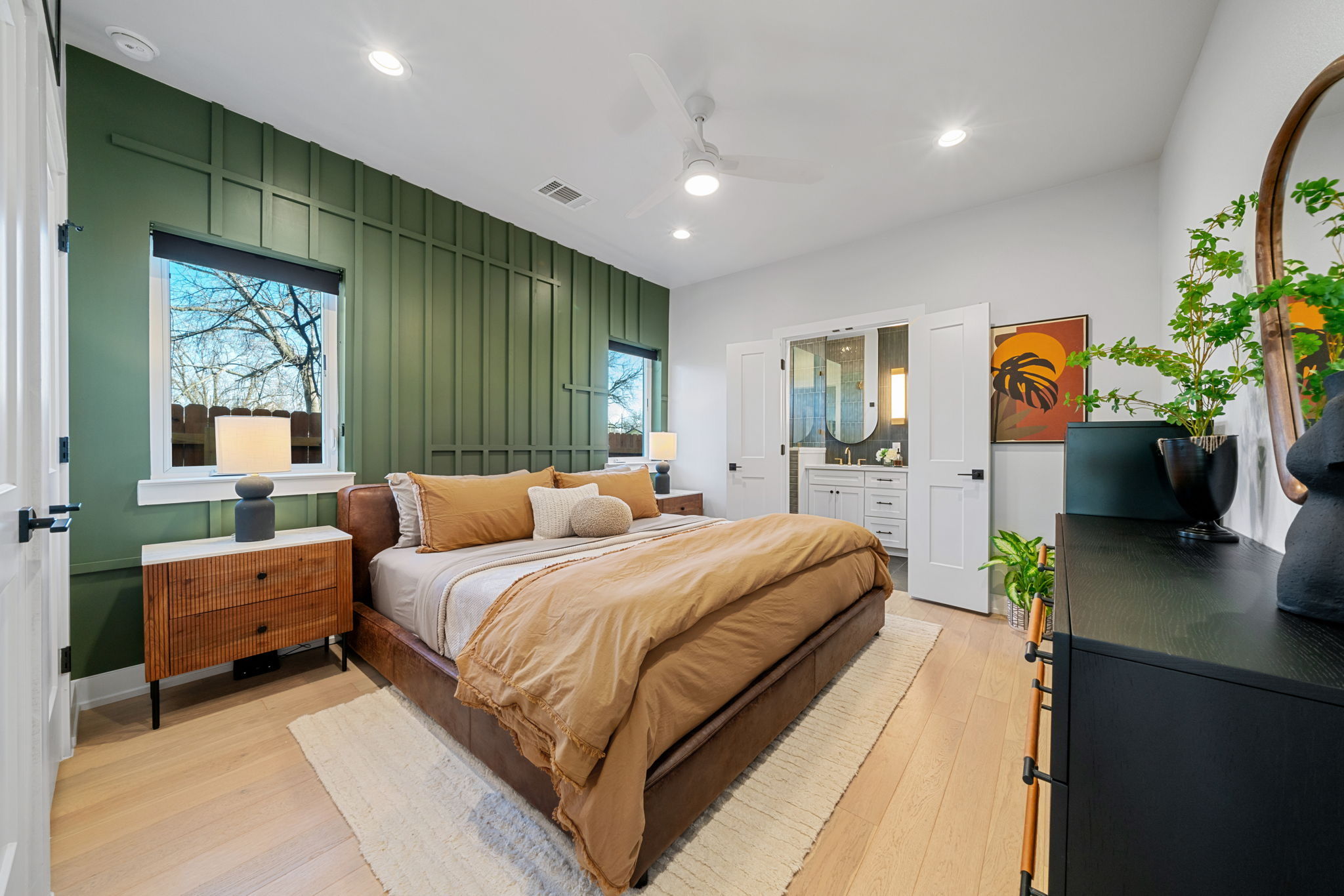 4607 Leslie Avenue, Unit A Austin, TX 78721 - Photo 8 of 20 The luxurious primary suite is fun yet modern, with a stunning ensuite bathroom