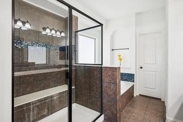 a bathroom with a shower and a mirror