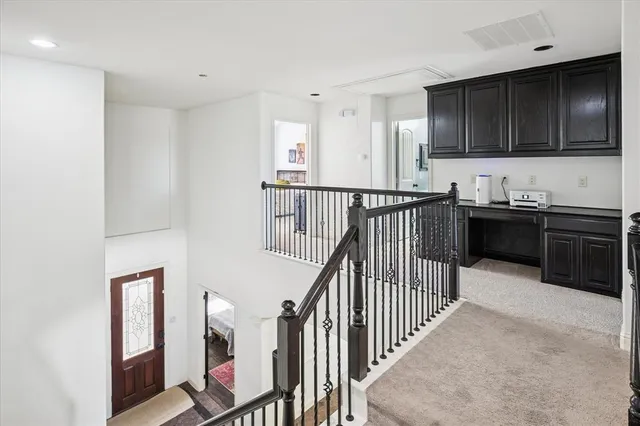 a view of kitchen with sink microwave and stove