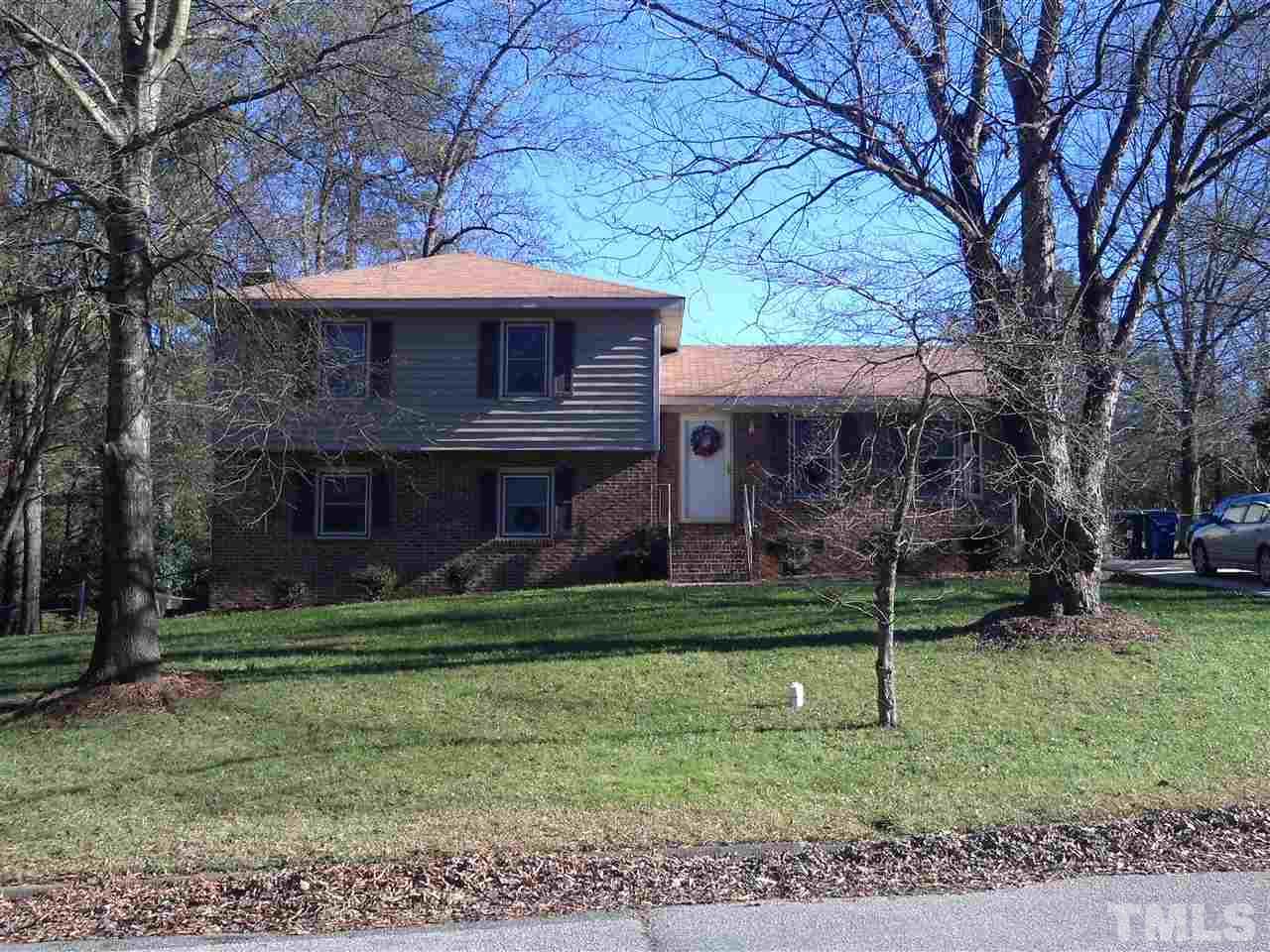 4300 Waterbury Road Raleigh, NC 27604 - Photo 1 of 4 a front view of a house with a garden