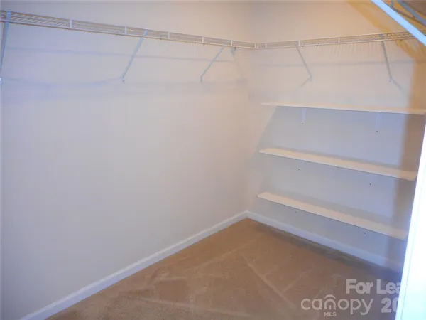 a view of a swimming pool and an outdoor seating