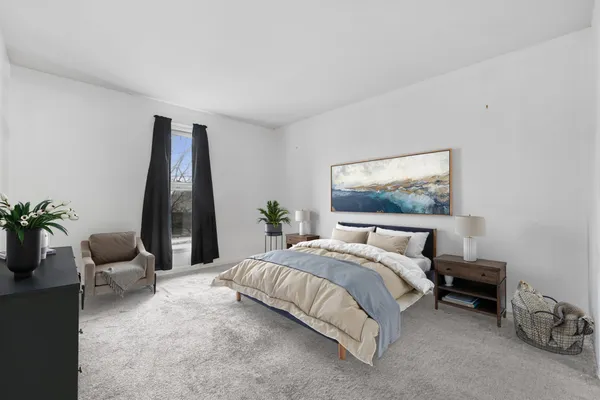 a bed room with a bed and a couch