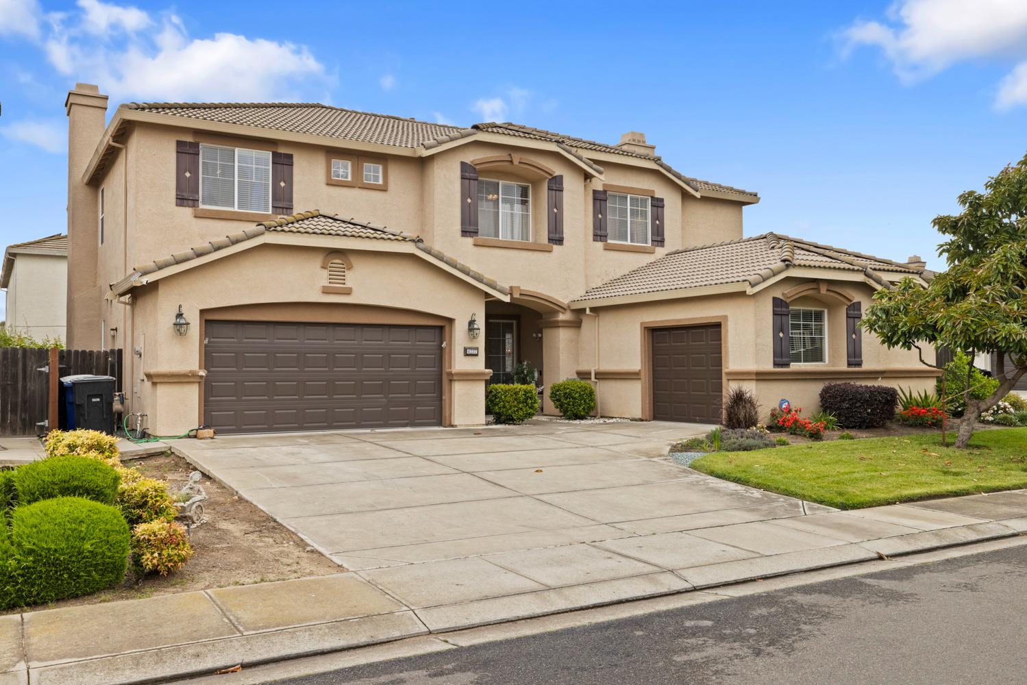 4237 Blake Drive Modesto, CA 95356 - Photo 1 of 49 a front view of a house with a yard and garage