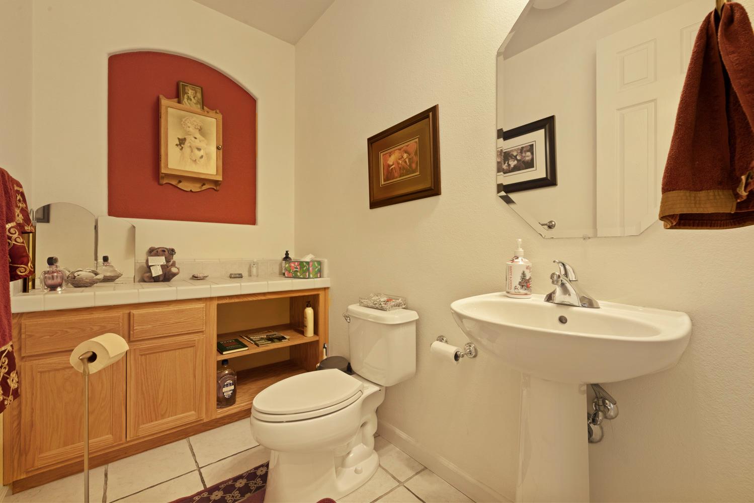 4237 Blake Drive Modesto, CA 95356 - Photo 12 of 49 a bathroom with a sink mirror vanity and toilet