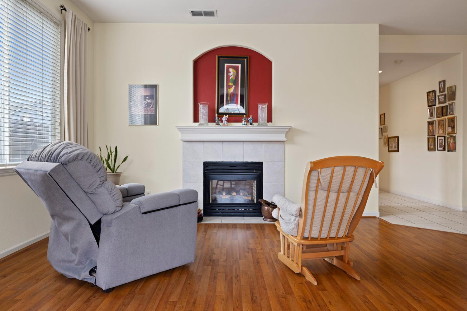 4237 Blake Drive Modesto, CA 95356 - Photo 14 of 49 a living room with furniture fireplace and wooden floor