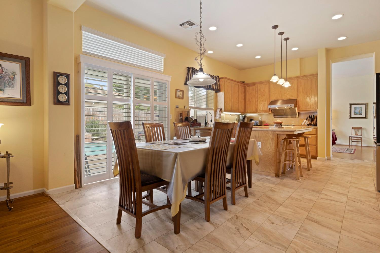 4237 Blake Drive Modesto, CA 95356 - Photo 22 of 49 a view of a dining room with furniture window and wooden floor