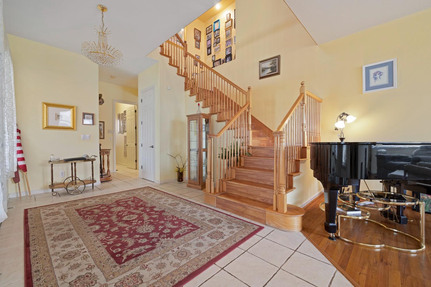 4237 Blake Drive Modesto, CA 95356 - Photo 29 of 49 a view of a hallway with the couches and dining table