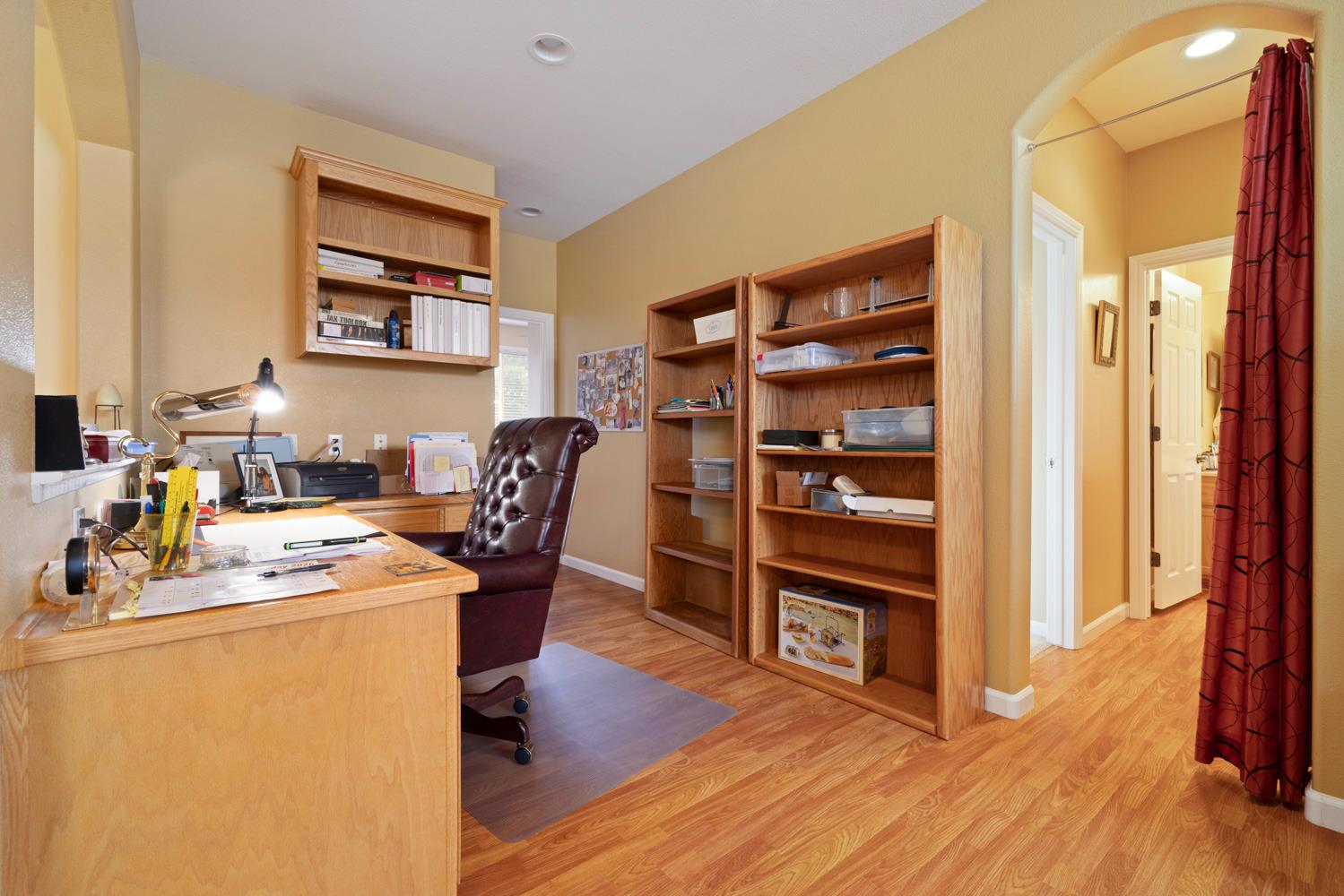 4237 Blake Drive Modesto, CA 95356 - Photo 32 of 49 a view of a workspace with furniture and wooden floor