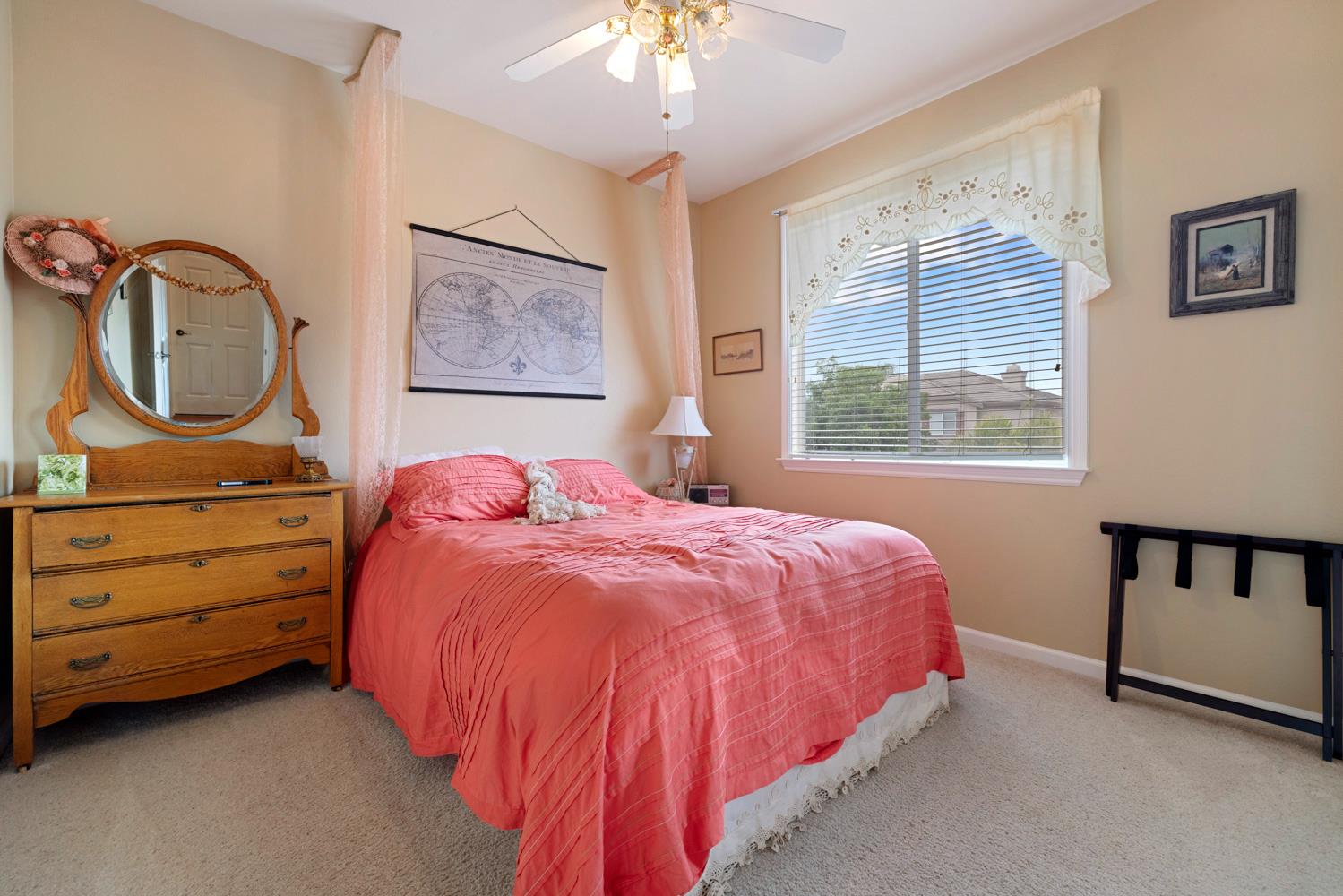 4237 Blake Drive Modesto, CA 95356 - Photo 35 of 49 a bedroom with a bed and a chandelier