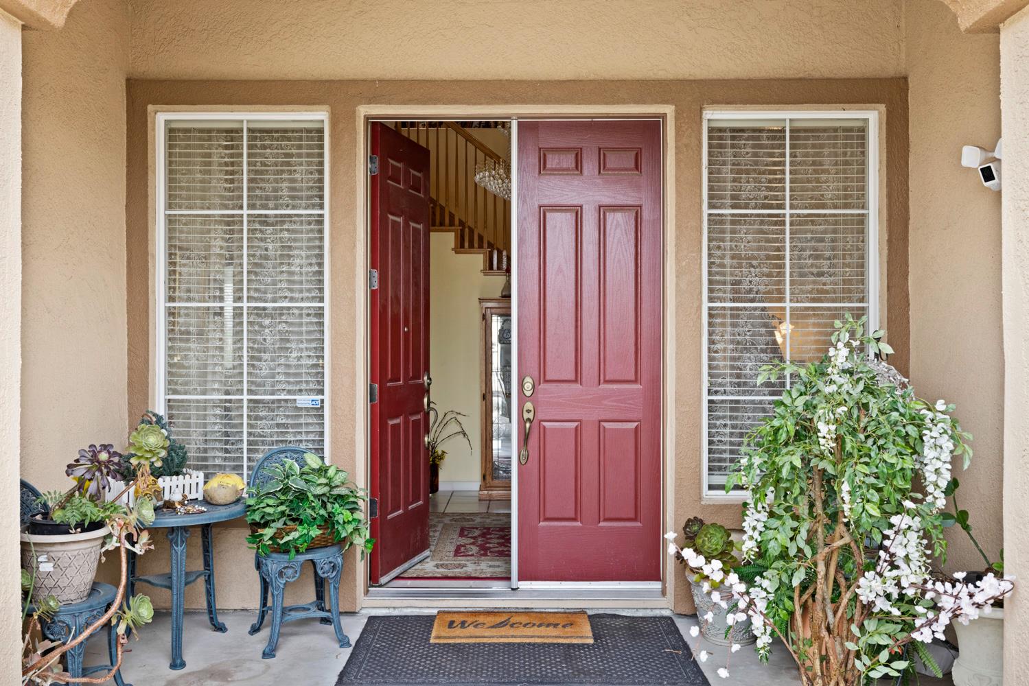 4237 Blake Drive Modesto, CA 95356 - Photo 4 of 49 a potted plant in front of a house