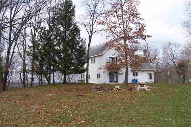 9293 West Diggin Hill Road Hanover, IL 61041 - Photo 11 of 19 a house view with a backyard space