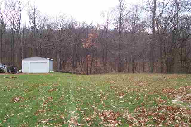 9293 West Diggin Hill Road Hanover, IL 61041 - Photo 14 of 19 a backyard of a house with lots of green space