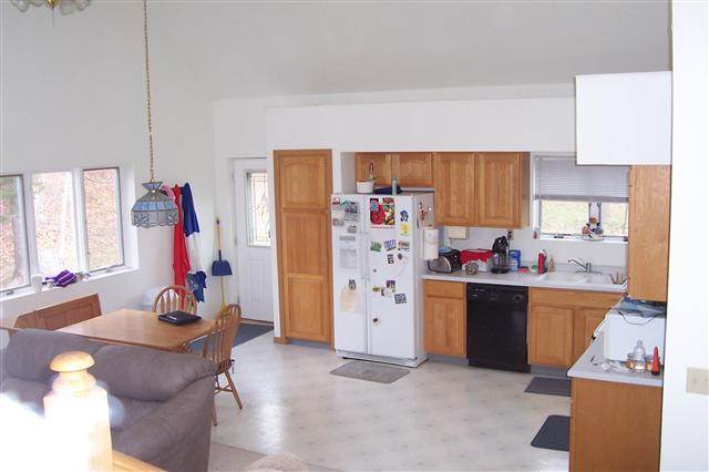 9293 West Diggin Hill Road Hanover, IL 61041 - Photo 16 of 19 a living room with furniture and a kitchen