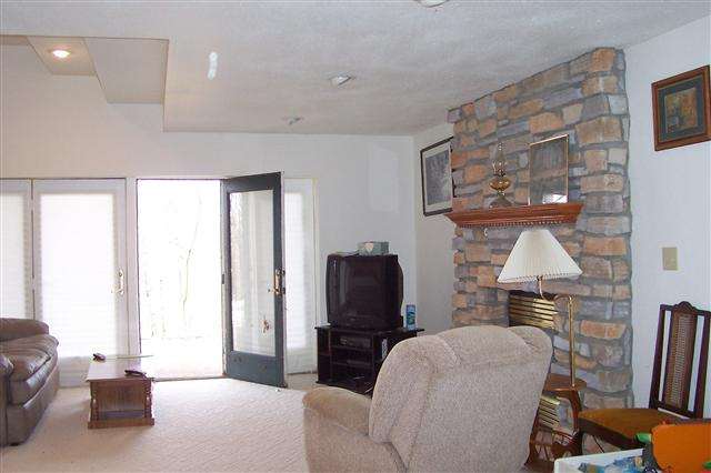 9293 West Diggin Hill Road Hanover, IL 61041 - Photo 19 of 19 a living room with furniture and a wooden floor