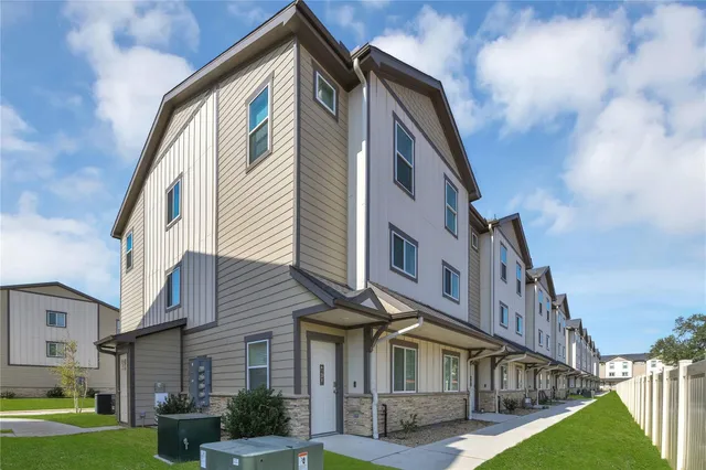 a view of a building with a yard