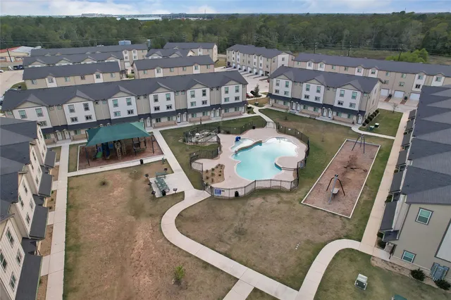 an aerial view of a house with a swimming pool