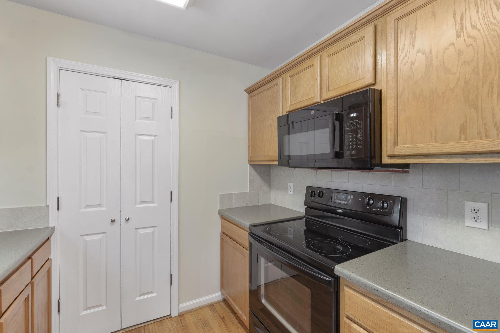 28 Lafayette Drive Palmyra, VA 22963 - Photo 12 of 35 a kitchen with stainless steel appliances granite countertop white cabinets and black stove top oven with granite countertops