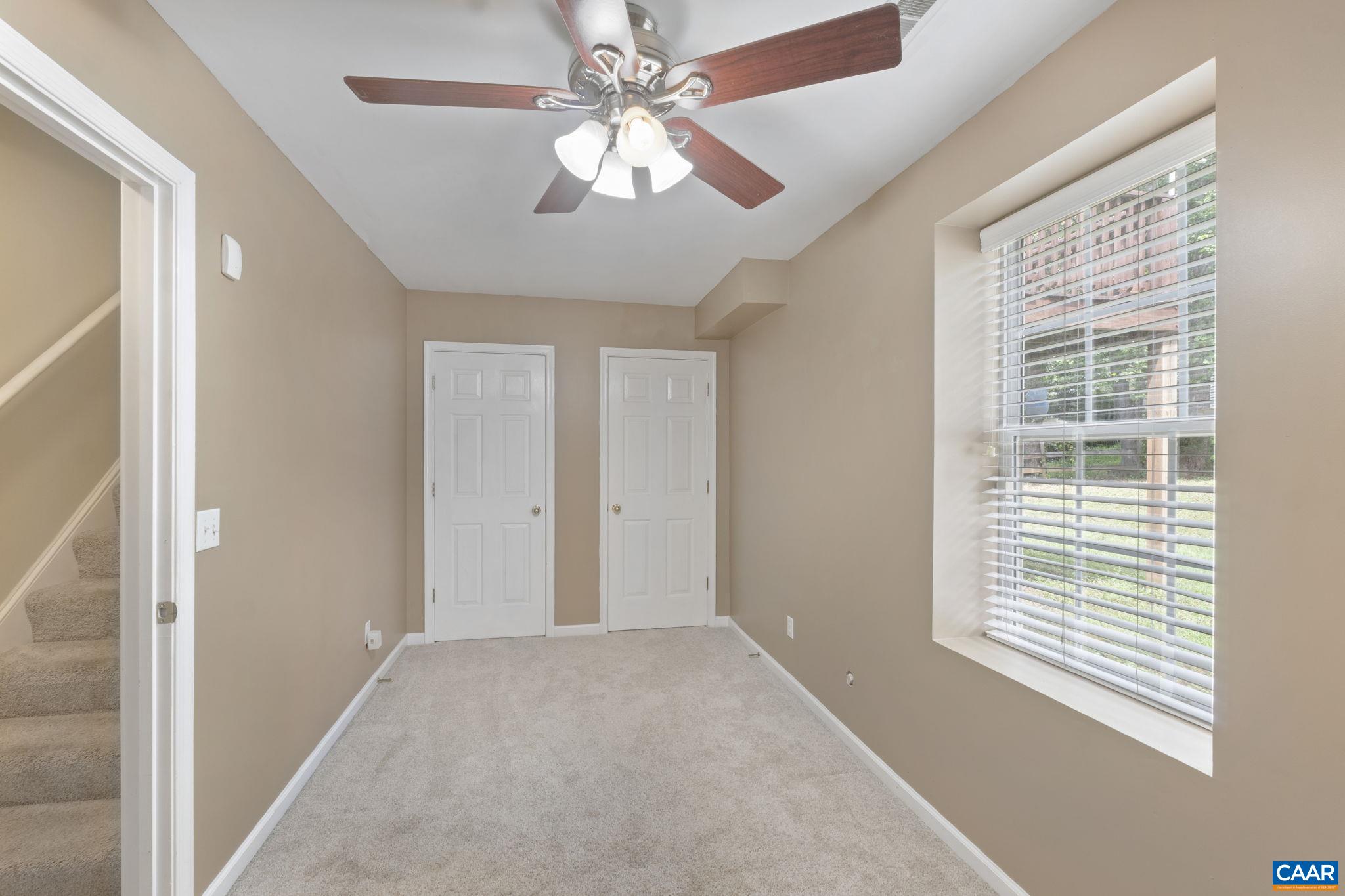 28 Lafayette Drive Palmyra, VA 22963 - Photo 23 of 35 a view of a livingroom with a ceiling fan and window
