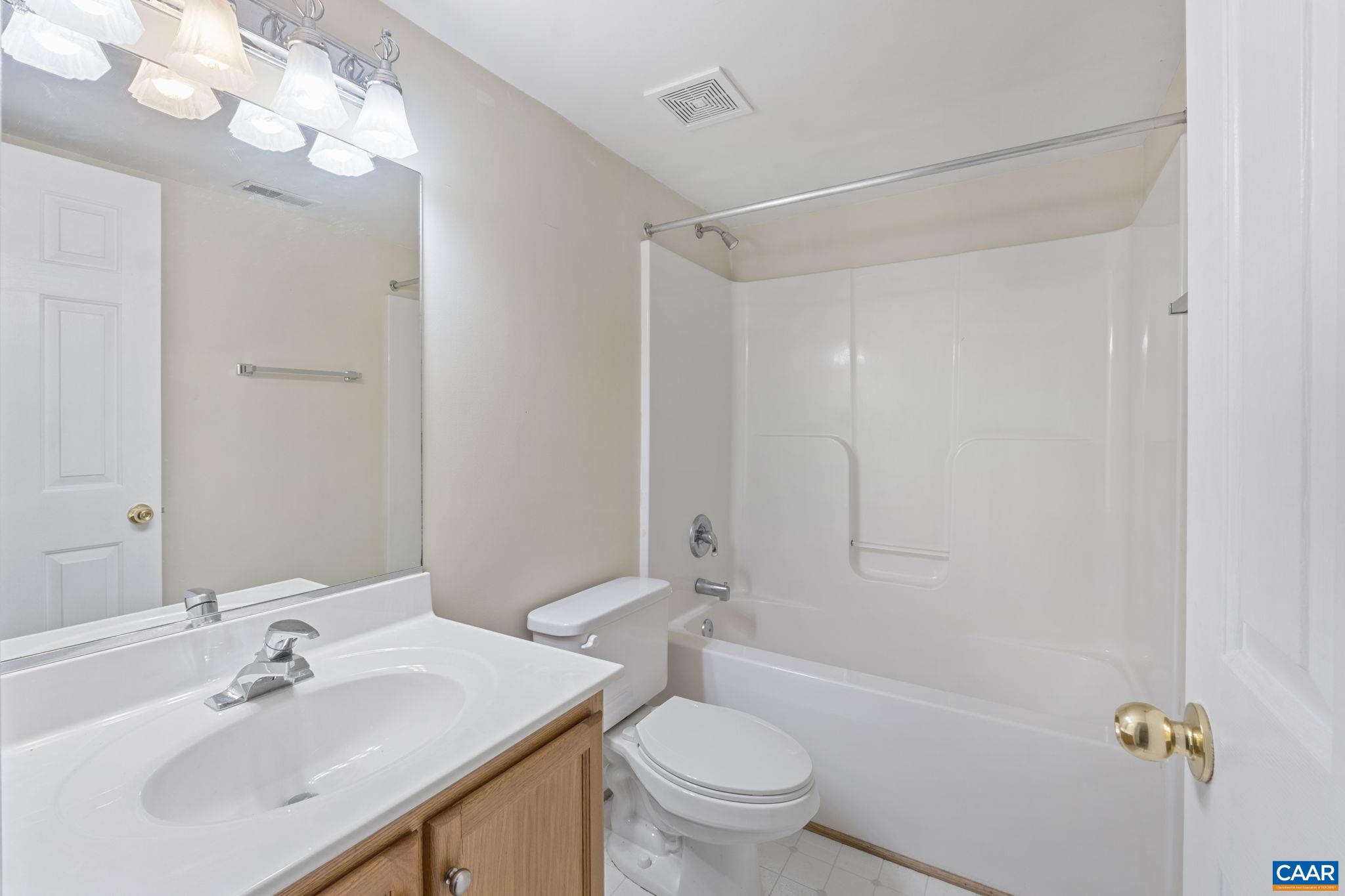 28 Lafayette Drive Palmyra, VA 22963 - Photo 24 of 35 a bathroom with a sink vanity mirror and toilet