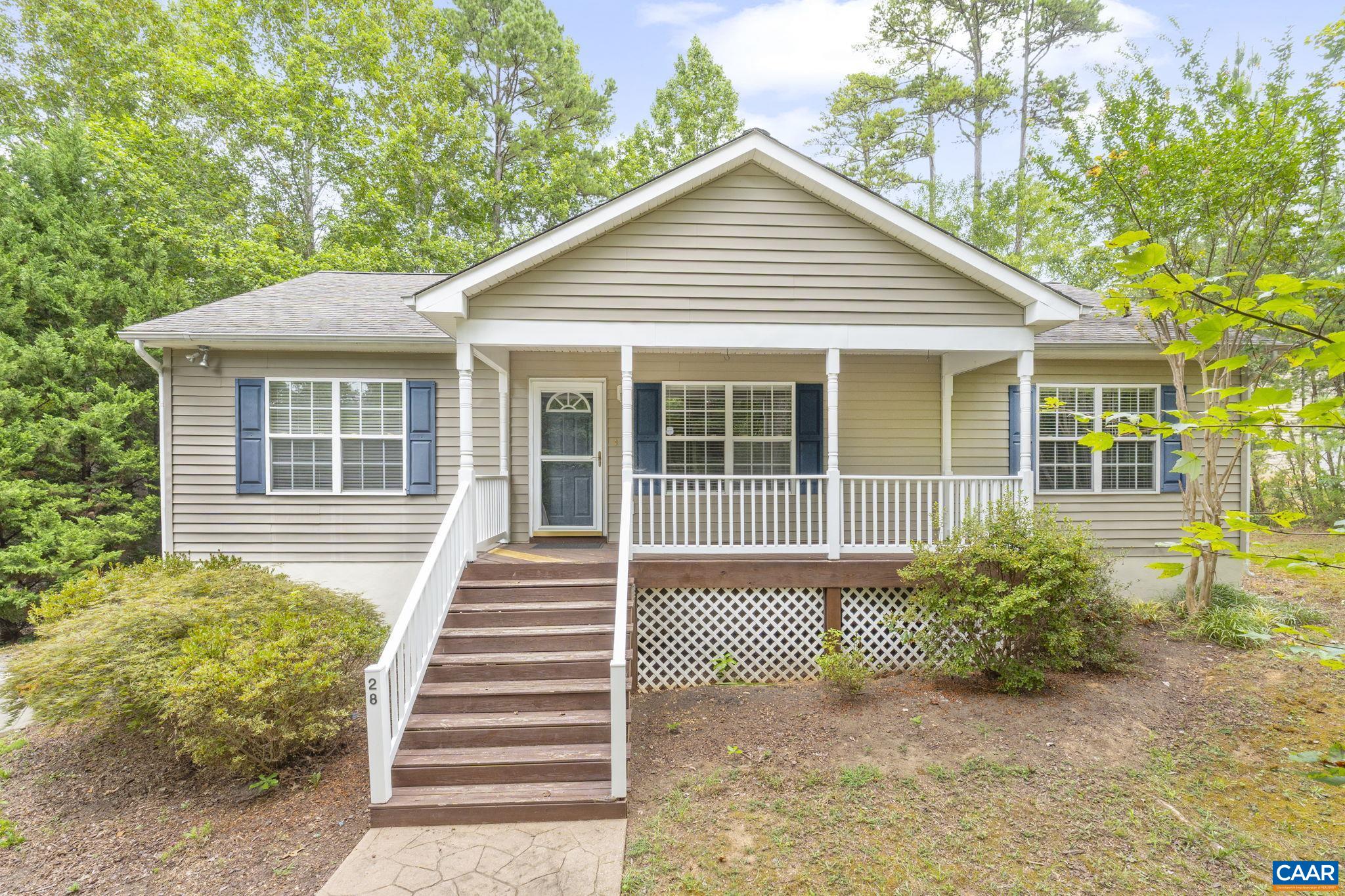 28 Lafayette Drive Palmyra, VA 22963 - Photo 9 of 35 a front view of a house with a garden