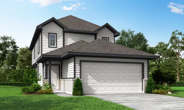 a front view of a house with a garden and plants