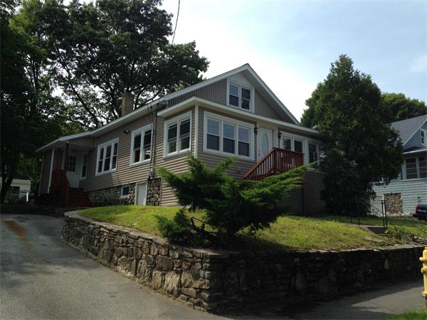 front view of a house with a yard