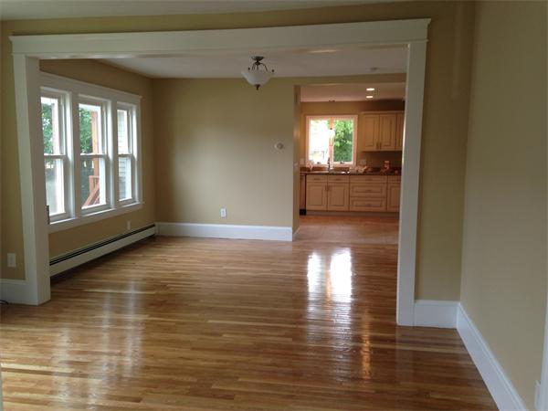 84 Eureka Street Worcester, MA 01603 - Photo 4 of 5 a view of a hallway with wooden floor and a bathroom