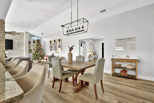 a view of hallway with stairs and wooden floor