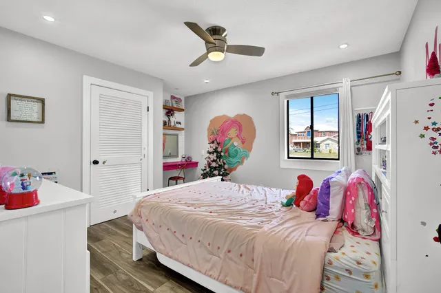 a living room with furniture and flowers