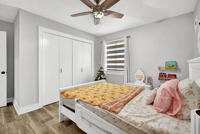 a kitchen view of a stove and a wooden floor