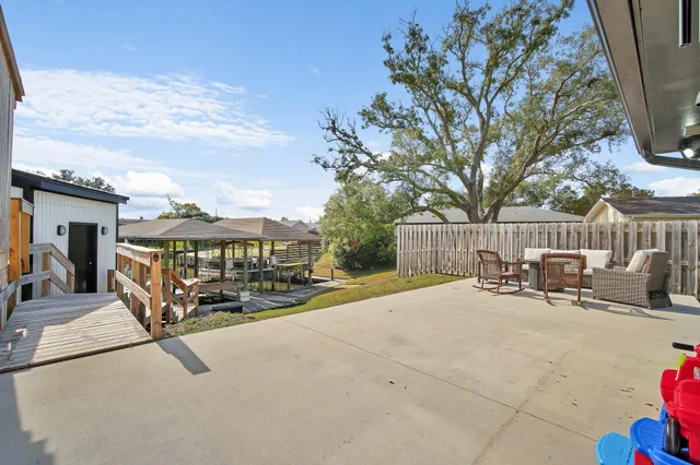 a view of a balcony with wooden floor