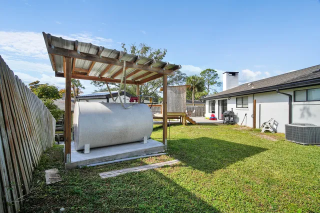 a bedroom with furniture and a flat screen tv