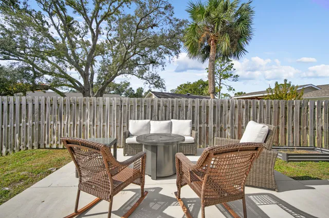 an aerial view of a house with a garden and houses
