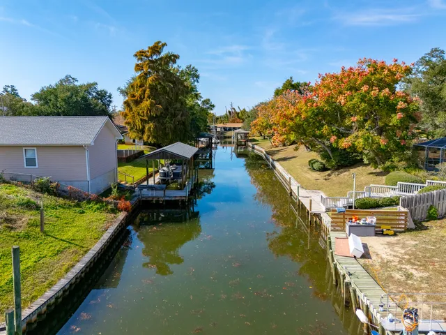 a view of house with outdoor space and swimming pool