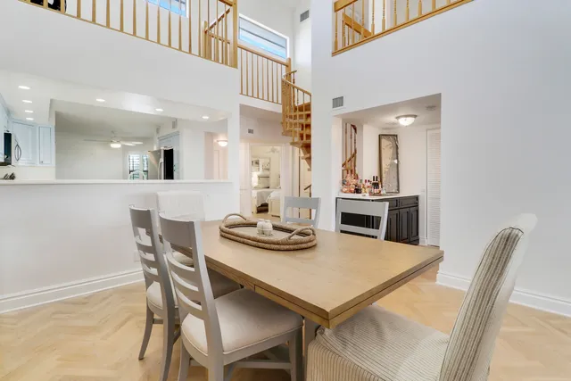 a kitchen with white cabinets stainless steel appliances and sink