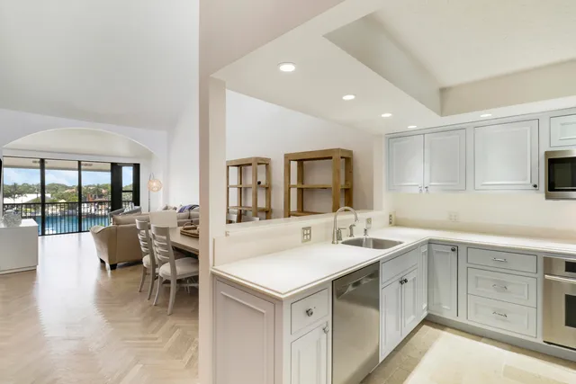 a bedroom with two beds and painting on the wall