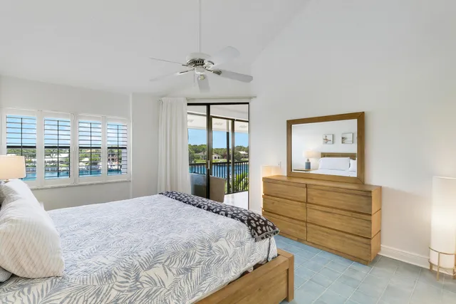 a view of a hallway with a livingroom and entryway