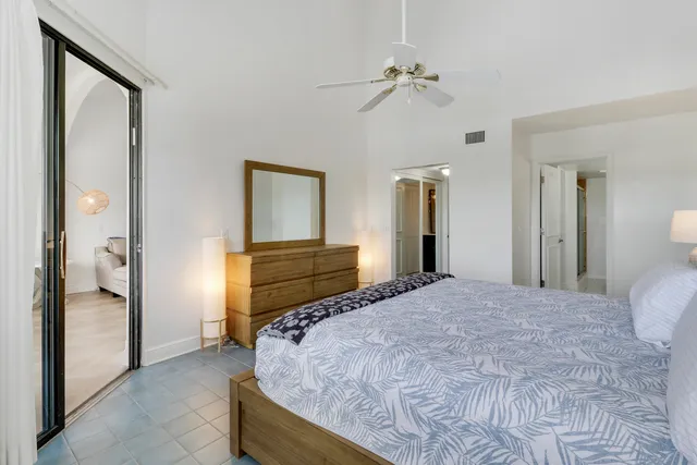 a view of a patio with a table and chairs under an umbrella
