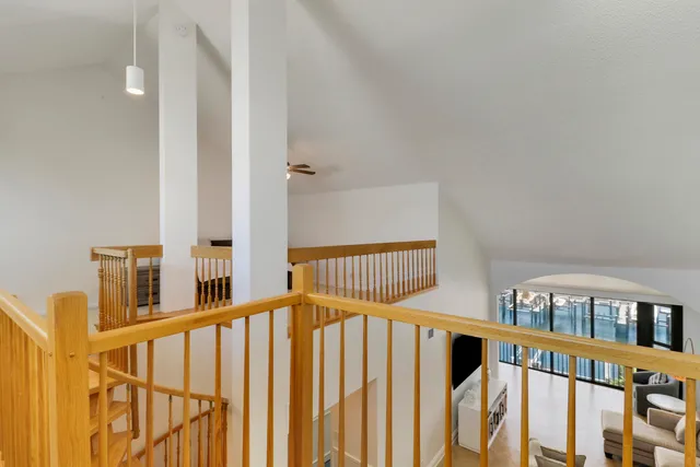 a living room with furniture and a painting on the wall